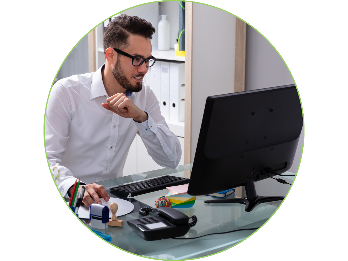 Person working at a desk on a computer